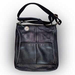 The Sak Black Genuine Leather Tassel Crossbody with Peace Print Interior